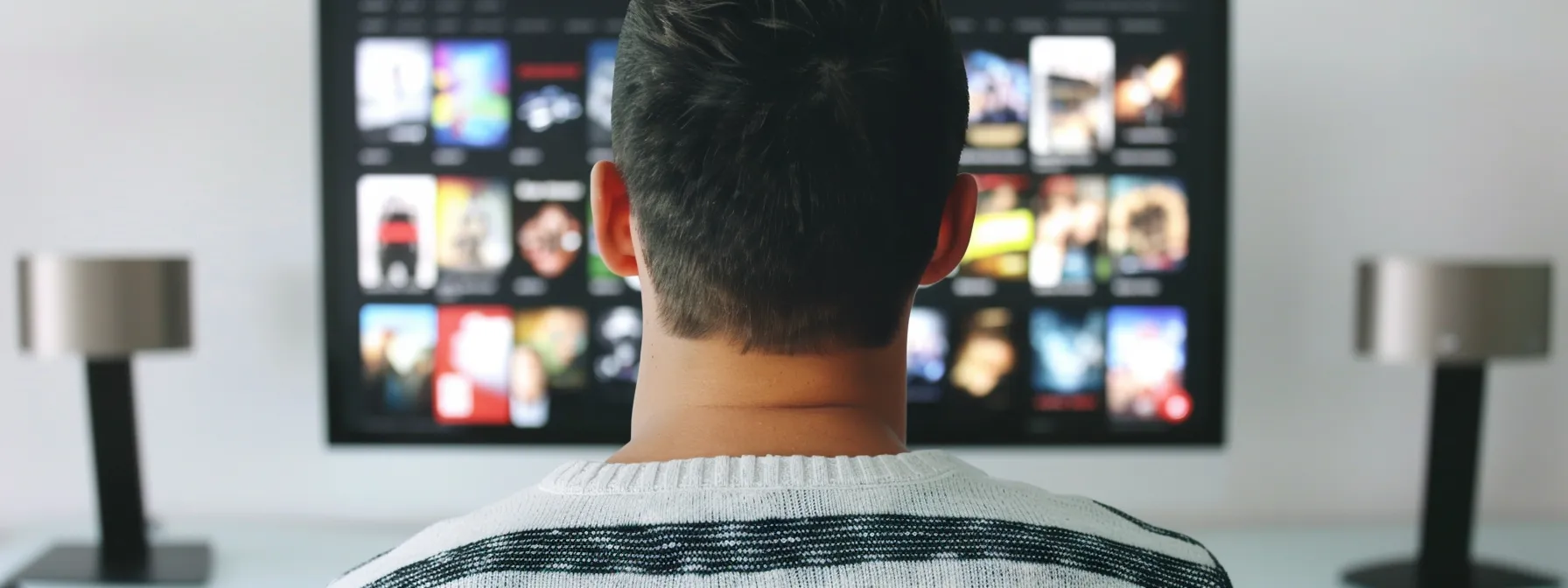 a person comparing different iptv service packages on a sleek, modern computer screen.